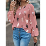 Elegant chiffon blouse with feather pattern—long sleeves and stylish design for a chic look.