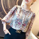 Elegant floral O-neck top with three-quarter sleeves—vintage-inspired, stylish, and perfect for summer.