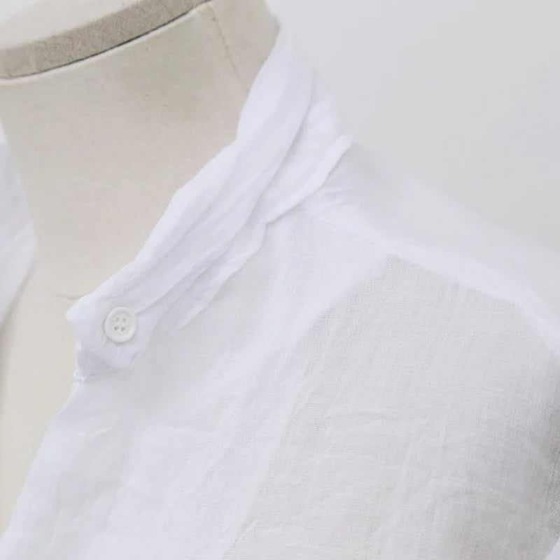 Women's linen long-sleeve white shirt—lightweight, stylish, and perfect for summer fashion."
